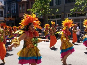 tiny travel chick travel experience carnaval colorful dancers