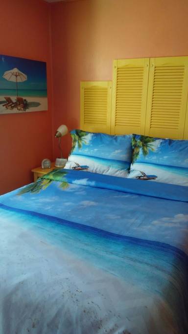 tiny travel chick incredible travel colorful corner airbnb queen bed