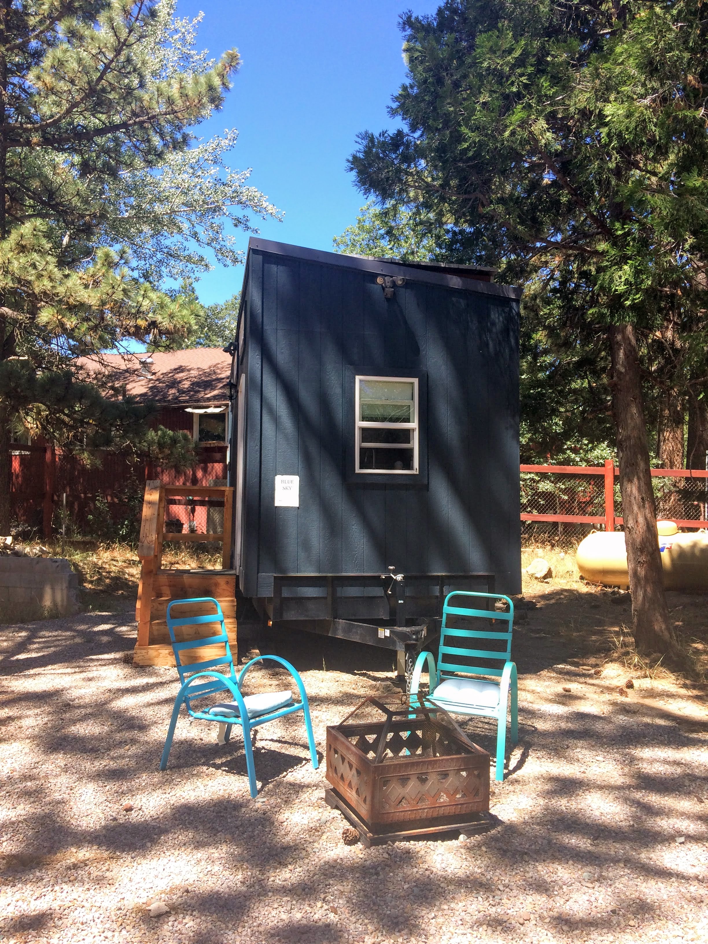 tiny travel chick tiny house block blue sky